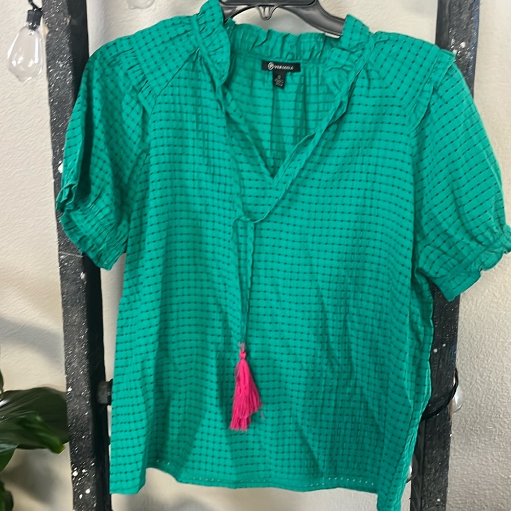 Green top with hot pink tassels.